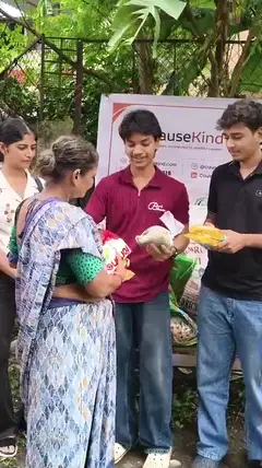 Volunteers handing supplies to a woman